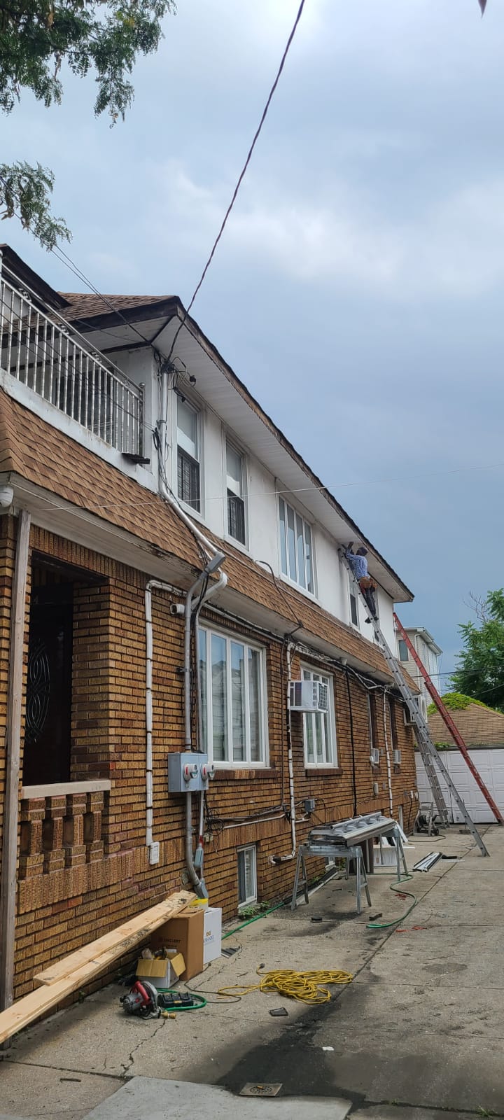 HIGHRISE ROOFING team working on residential roof
